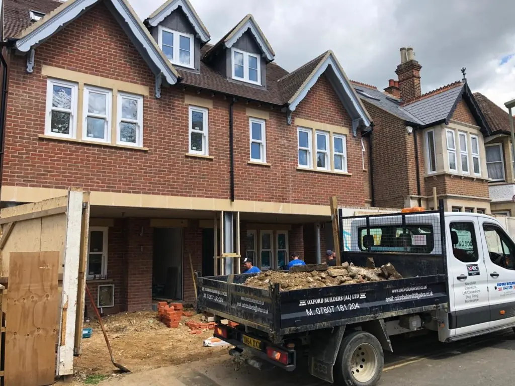 Oxford property under construction with scaffolding and site vehicles