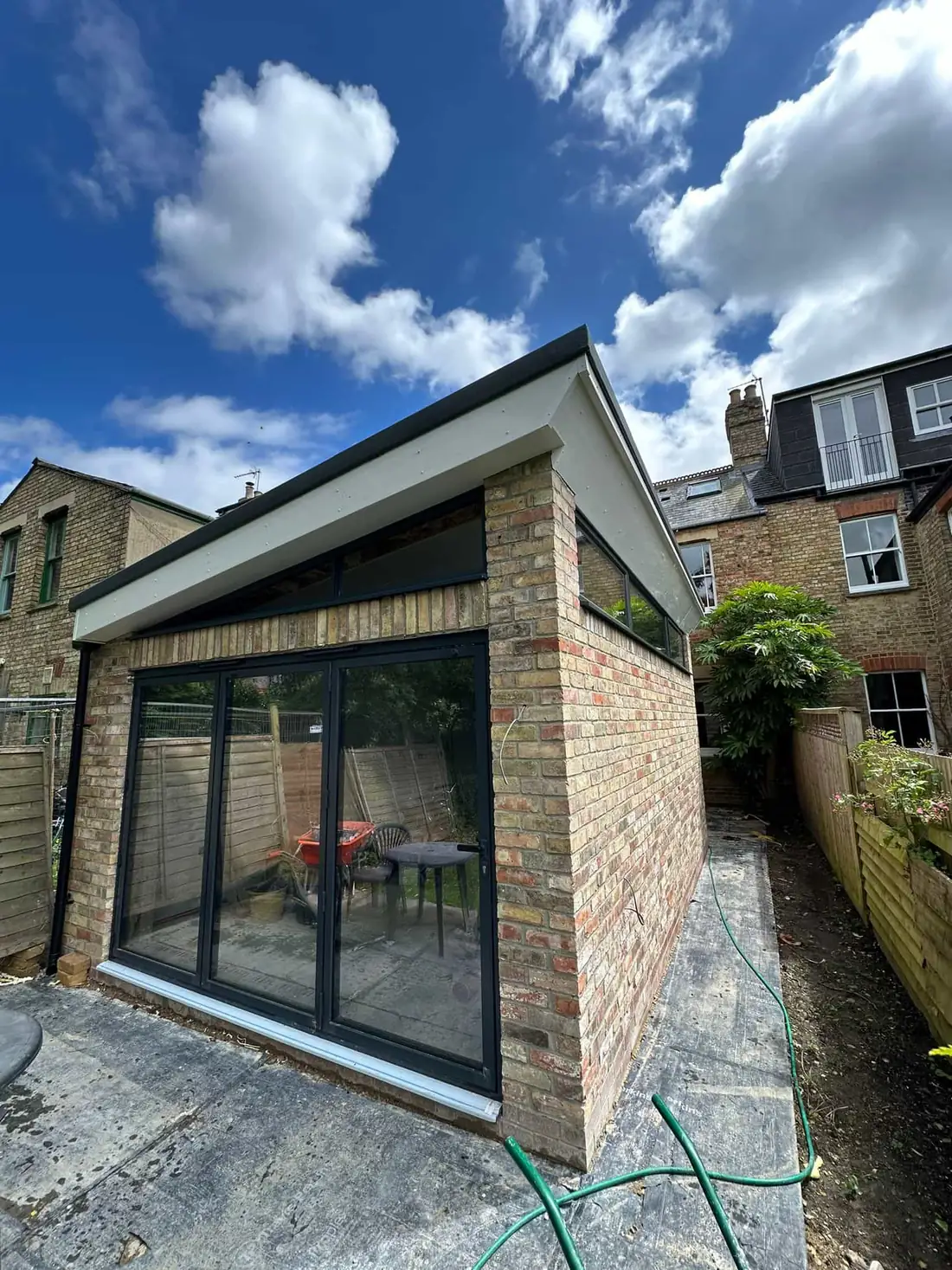 Single-storey rear extension in Oxford with bi-fold doors and brick facing