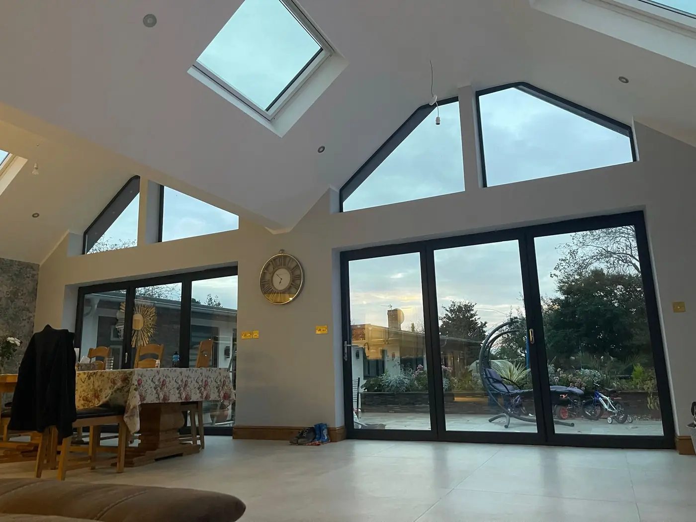 Extension interior in Oxford with a vaulted ceiling, rooflight and full-height glazing