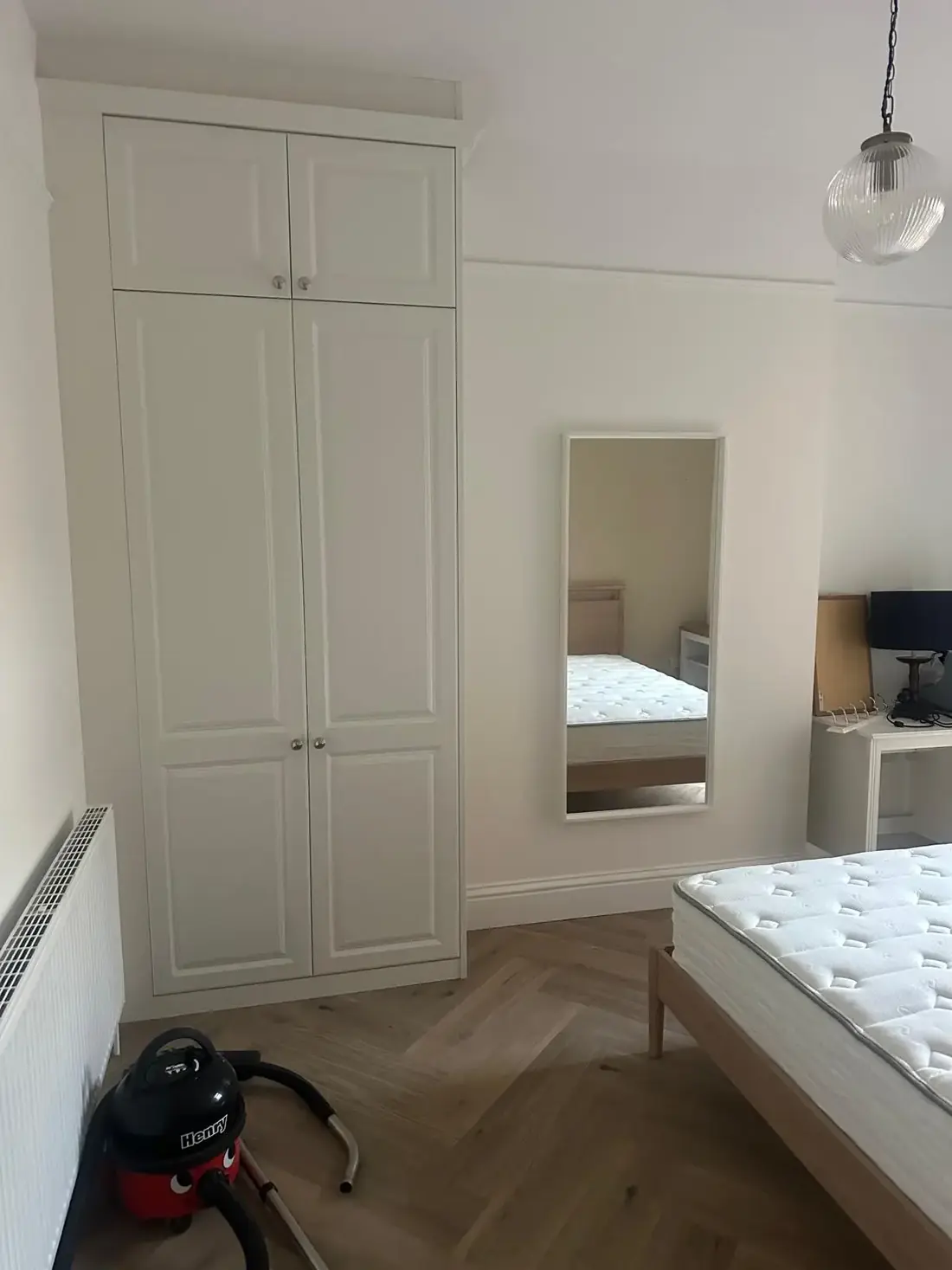 Refurbished bedroom in an Oxford property with new fitted wardrobe and decoration